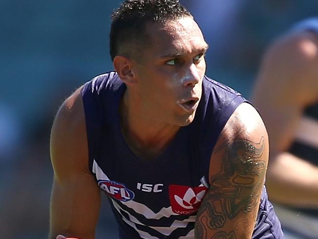 PERTH, AUSTRALIA - MARCH 12: Harley Bennell of the Dockers gathers the ball during the NAB Challenge match between the Fremantle Dockers and the Geelong Cats at Domain Stadium on March 12, 2016 in Perth, Australia.  (Photo by Paul Kane/Getty Images)