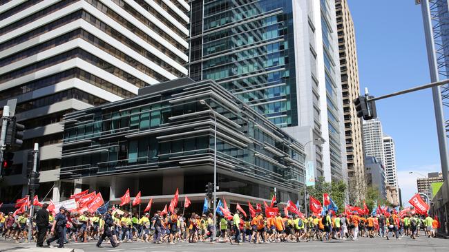 CFMEU members march in protest from Ann Street in the valley to Roma Street then onto parliament house. Picture: Jack Tran