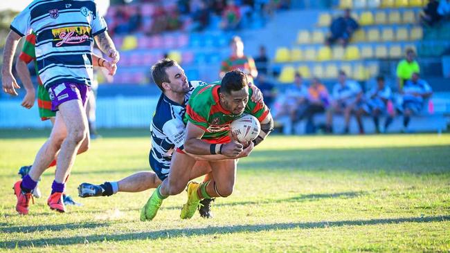 TRY: Ben Otter is unable to stop Logona Vetemotu scoring another try for Hervey Bay Seagulls. Picture: Brian Cassidy