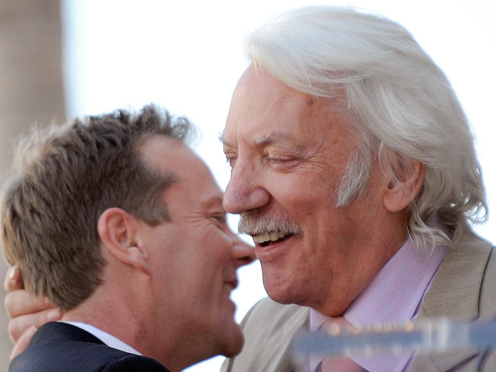 Kiefer Sutherland and his Donald Sutherland embrace after being honoured with the 2377th Star on the Hollywood Walk of Fame in December 9, 2008. Picture: AFP