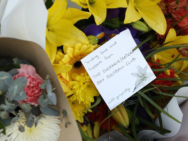 DAILY TELEGRAPH JUNE 13, 2023. Floral tributes left near the scene of the horrific bus crash, which killed 10 people and injured 25 others at Greta in the Hunter wine country. Picture: Jonathan Ng