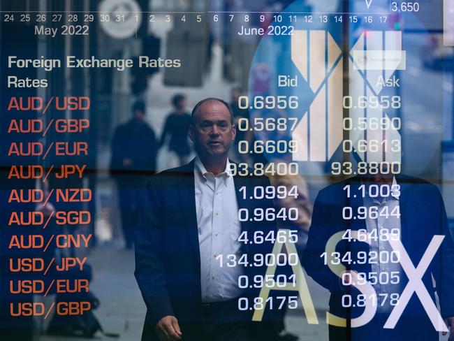 SYDNEY, AUSTRALIA - NEWSWIRE PHOTOS June 20 2022: A general view of people walking past the Australian Stock Exchange in Sydney ahead of the budget announcement. Picture NCA Newswire/ Gaye Gerard.