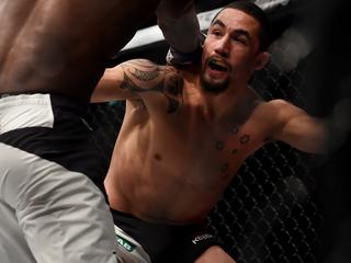 Robert Whittaker of Australia (right) fights Derek Brunson of the USA in the Middleweight Bout during the UFC Fight Night at Rod Laver Arena in Melbourne, Sunday, Nov. 27, 2016. (AAP Image/Tracey Nearmy) NO ARCHIVING, EDITORIAL USE ONLY