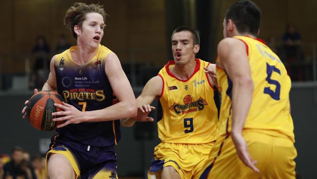 Sean Bairstow (left) of South West Metro Pirates in action in the Queensland Basketball League last year. Picture: AAP/Regi Varghese