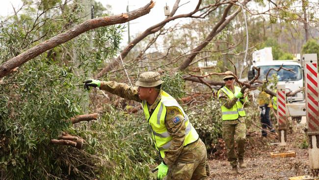 ADF help clean-up the Gold Coast hinterland suburb of Wongawallan after the Christmas storms. Picture: Adam Head