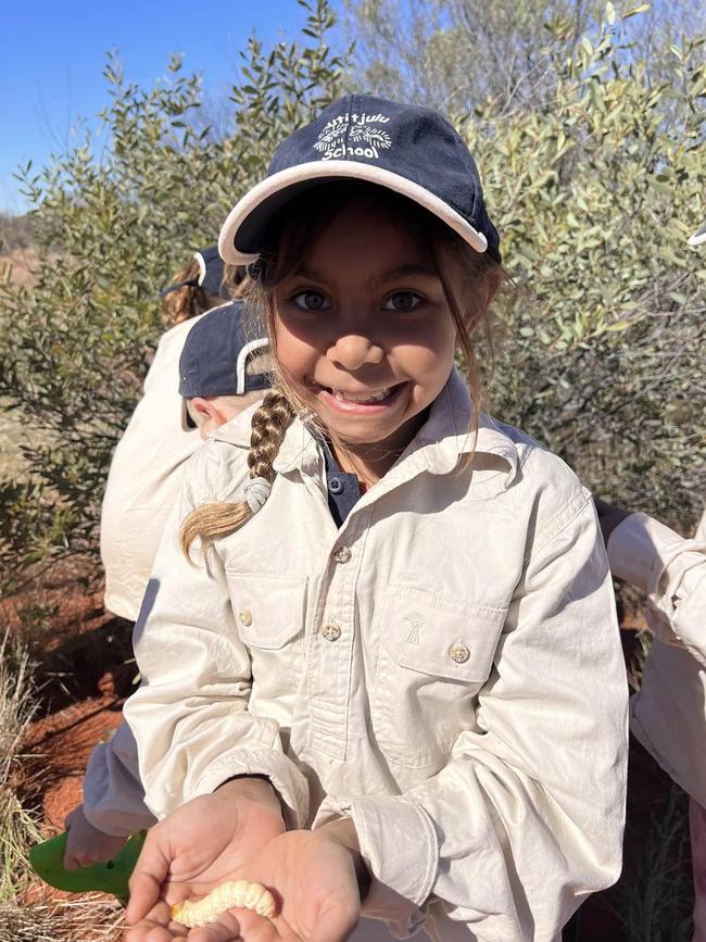 The Central Land Council took Mutitjulu School students on several outback excursions to look for tracks, burrows and bush foods. Picture: Department of Education