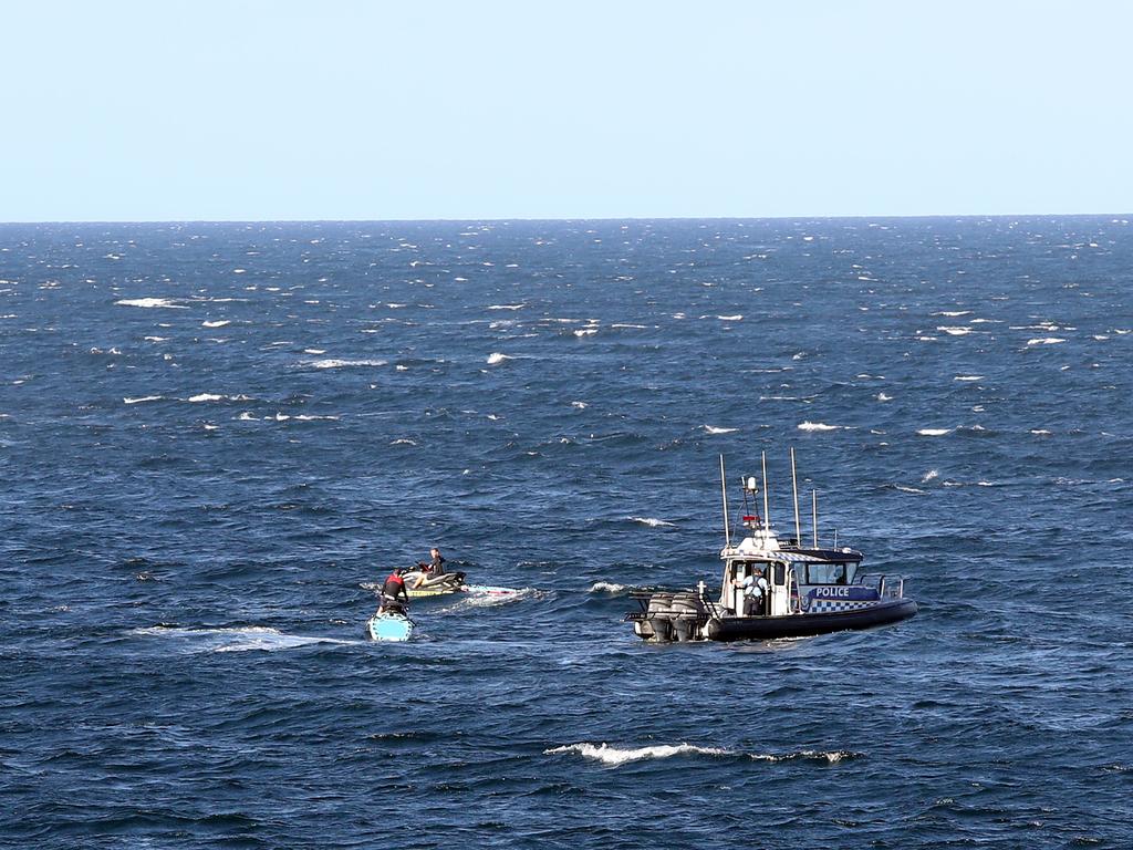 Police and surf rescue look for the body of a man who was attacked by a shark at Little Bay in Sydney. Picture: Richard Dobson