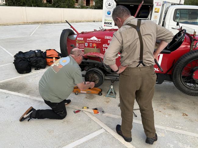 Bean team mechanic Tony Jordan takes a look at a noisy rear wheel in Orikum Albania. Picture: Supplied