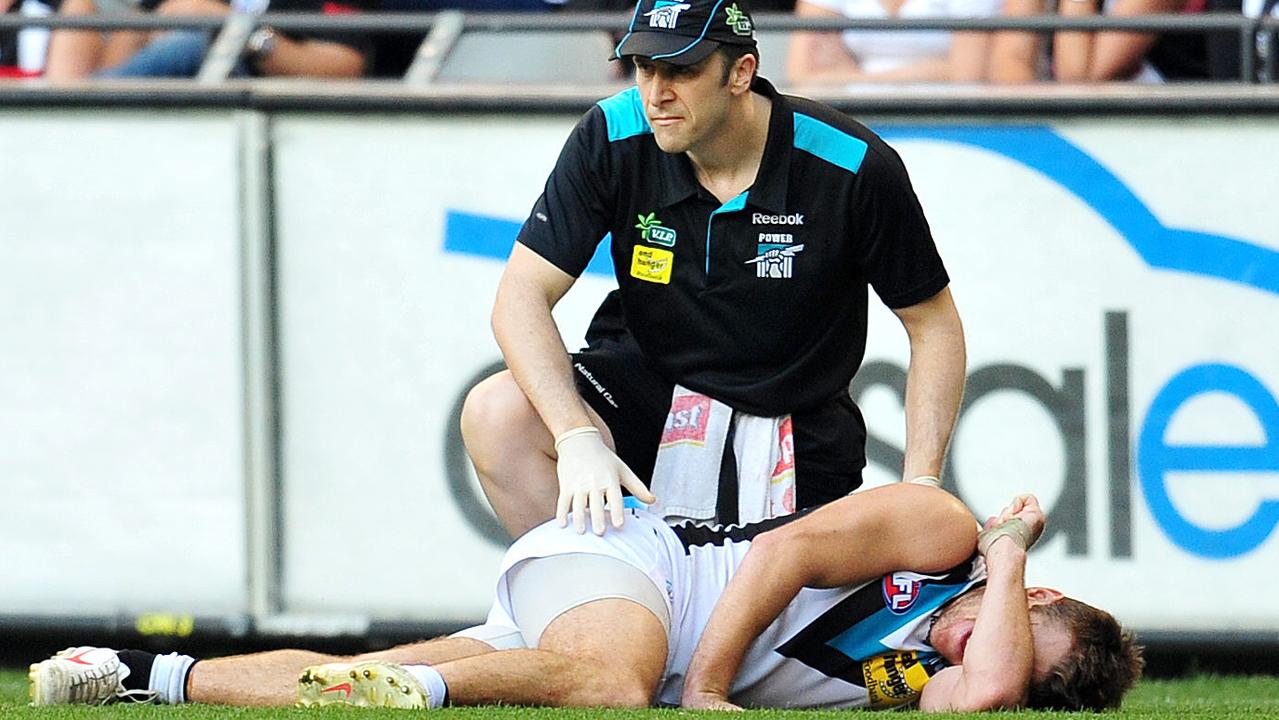 Port Adelaide injures his knee at Etihad Stadium in 2012.