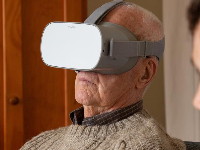 Death Railway veteran James Kerr watches the Anzac360 VR film of Hellfire Pass, at his home in Melbourne with Justin Lees of News360. Picture: Maxim Drygin.