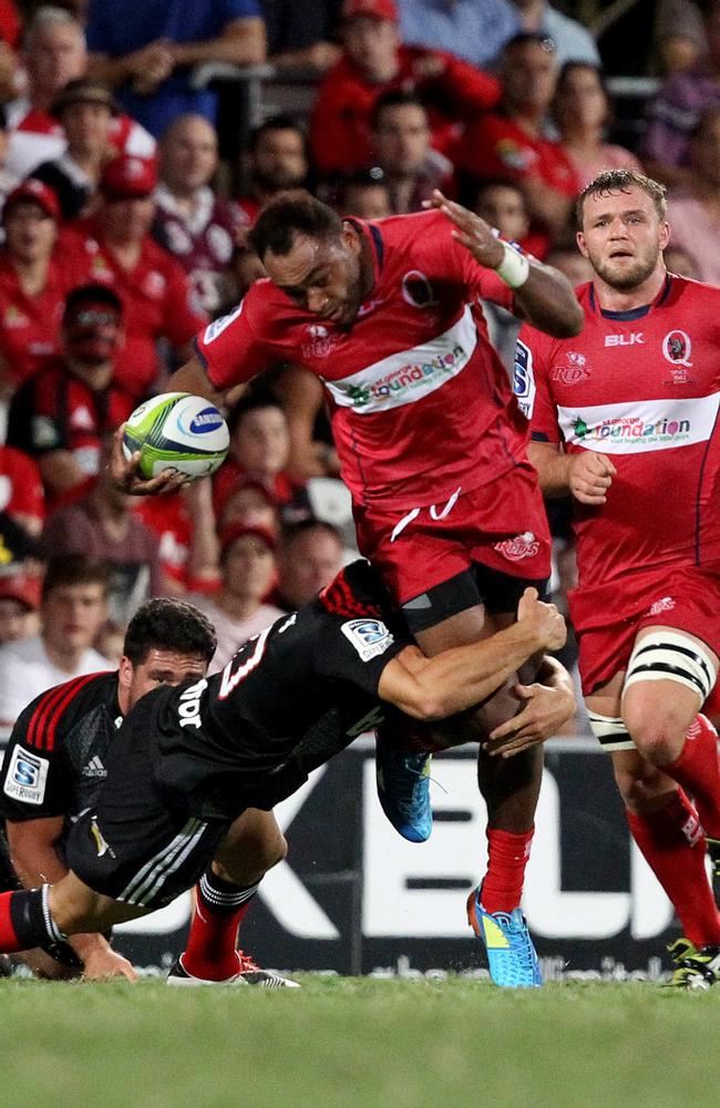 Chris Kuridrani tries to break through a Crusaders tackle.