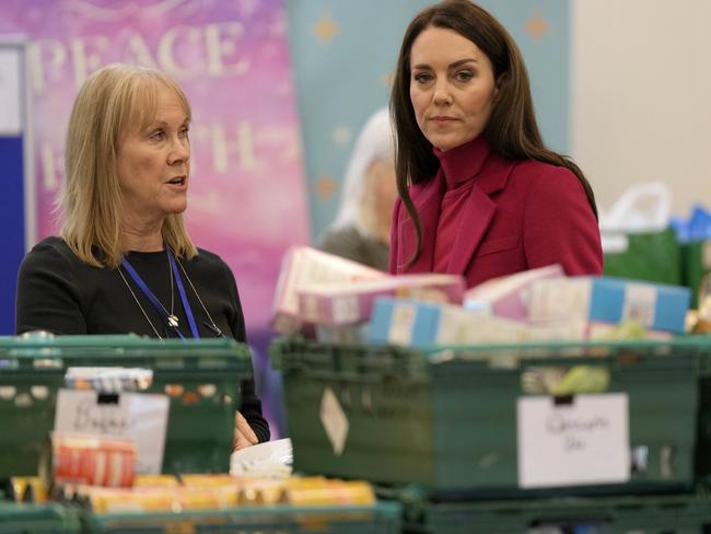 Catherine chats with a staff member at the Windsor Foodshare. Picture: Getty Images