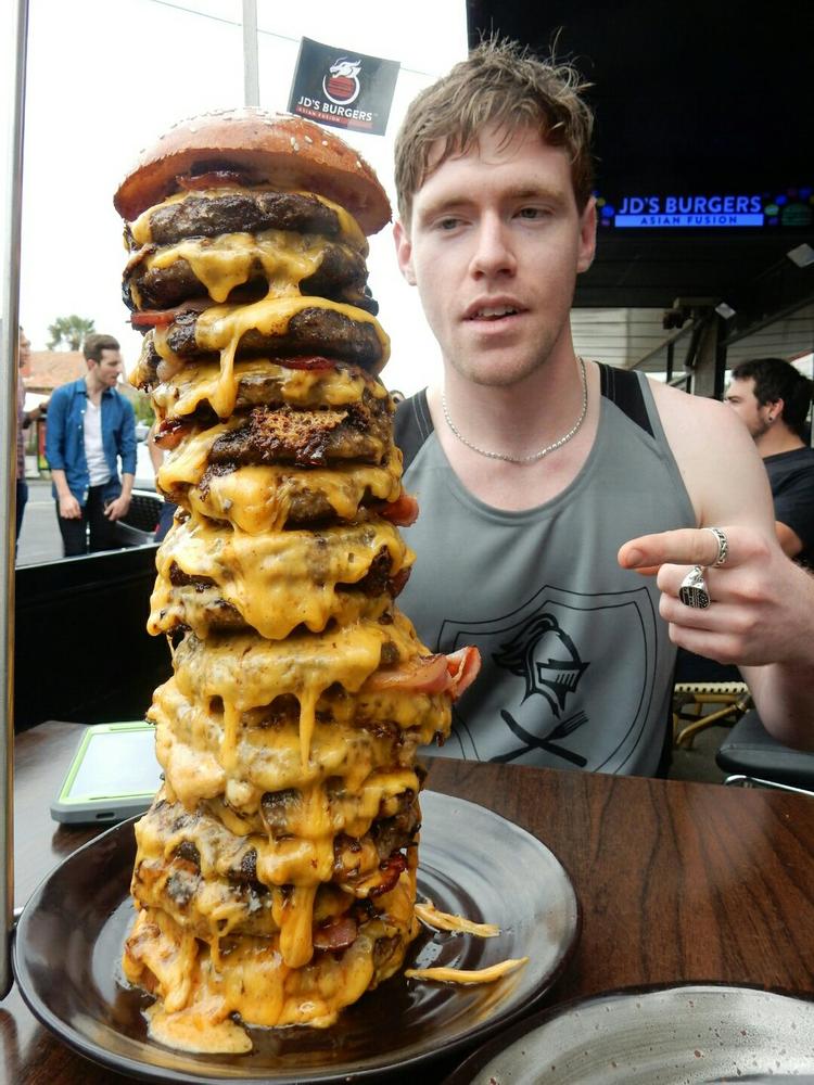 Competitive eater Issac Martin, aka Sir EatsALot in burger challenge Daily Telegraph