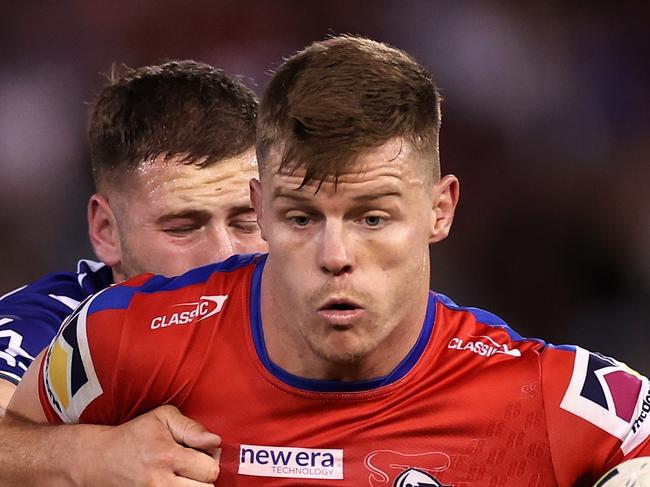 NEWCASTLE, AUSTRALIA - APRIL 09: Jayden Brailey of the Knights is tackled during the round six NRL match between Newcastle Knights and New Zealand Warriors at McDonald Jones Stadium on April 09, 2023 in Newcastle, Australia. (Photo by Cameron Spencer/Getty Images)