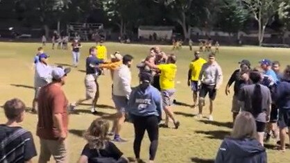 A screenshot of a video of parents fighting at an under-9s league match in Townsville on July 21, 2023.