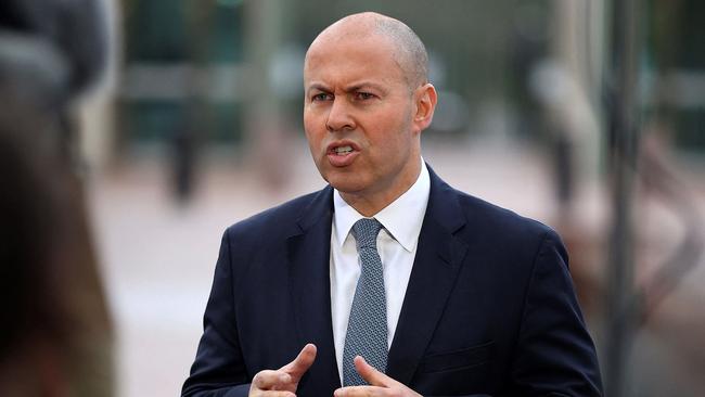 Australia's Treasurer Josh Frydenberg talks to the media outside Parliament House ahead of his federal budget speech. (Photo by AFP)