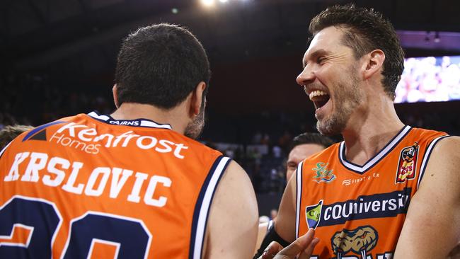 Alex Loughton and Fabian Krslovic of the Cairns Taipans celebrate winning their game after the Round 12 NBL match between the Cairns Taipans and the Brisbane Bullets at the Cairns Convention Centre in Cairns, Thursday, January 3, 2019. (AAP Image/Dave Acree) 