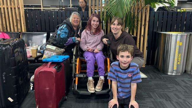 Kylie (right) Emily (centre) and Henry (front) pictured with Kylie's mum Chris Huismann waiting at Avalon