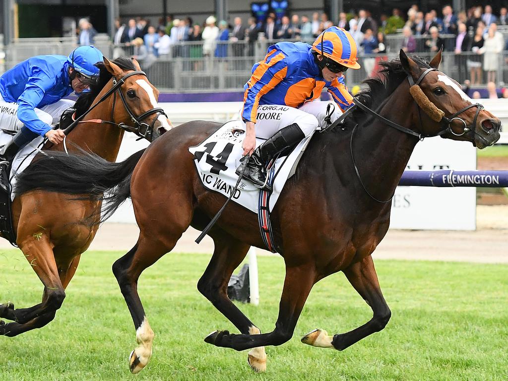 Moore and Magic Wand lead Hugh Bowman and Hartnell (left) home in the Mackinnon Stakes.