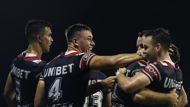 James Tedesco, celebrating with teammates, (Photo by Albert Perez/Getty Images)