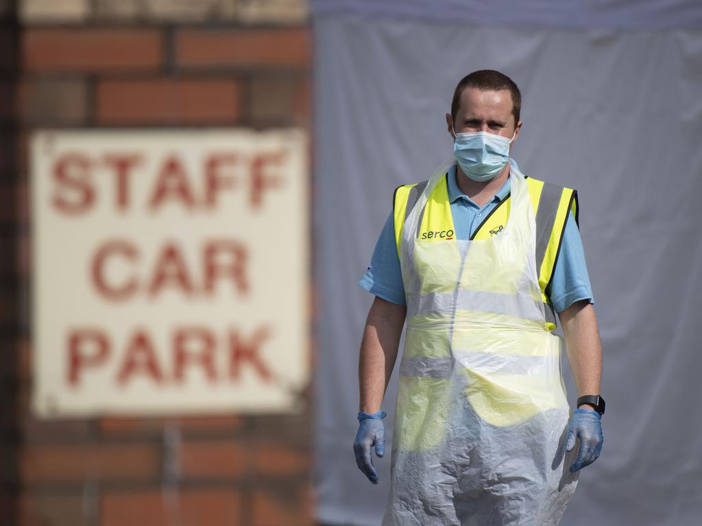 A healthcare worker looks on at a temporary coronavirus testing centre in Wales, UK. Picture: Matthew Horwood/Getty Images