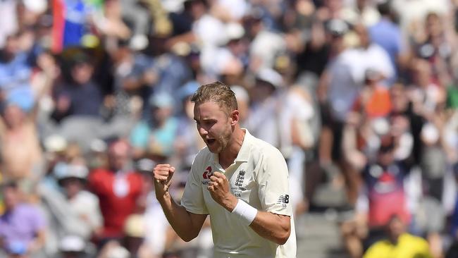 England's Stuart Broad celebrates taking the wicket of Australia's Usman Khawaja during their Ashes cricket test match in Melbourne, Australia, Tuesday, Dec. 26, 2017. (AP Photo/Andy Brownbill)