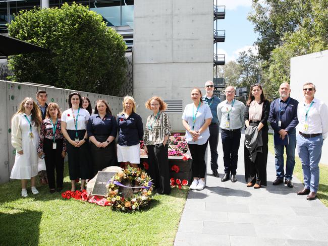 Members of the Optus United Employee Network and Optus team members at the Optus Remembrance Garden in Sydney.