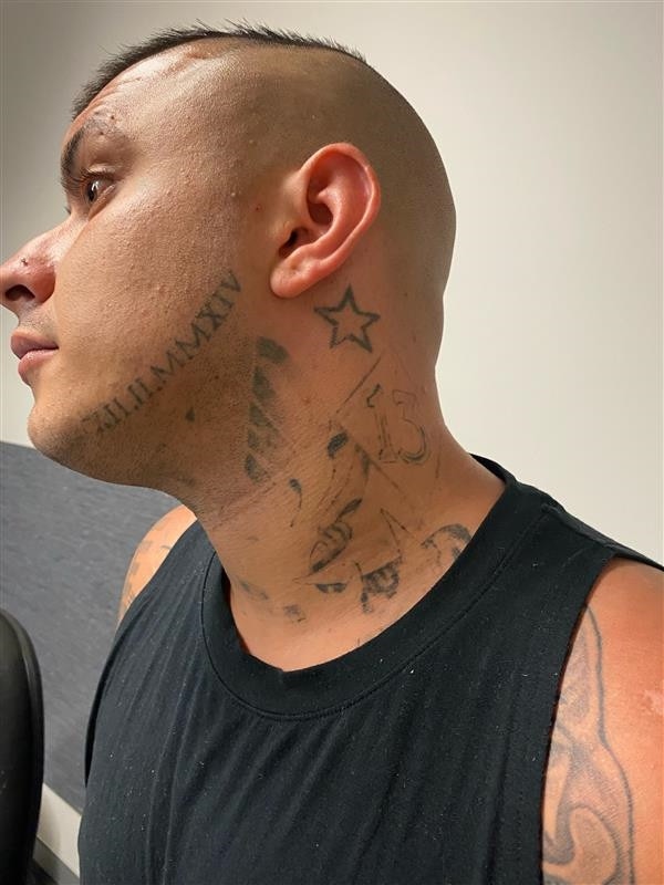 Horne has distinctive tattoos on his neck.