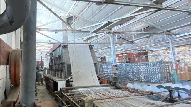 Machinery and textiles inside the Rocklea factory. Picture: Marianne Taylor