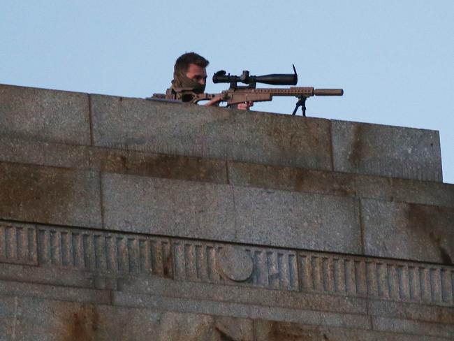 Tight security. A sniper on the roof of the Shrine. Picture: AAP