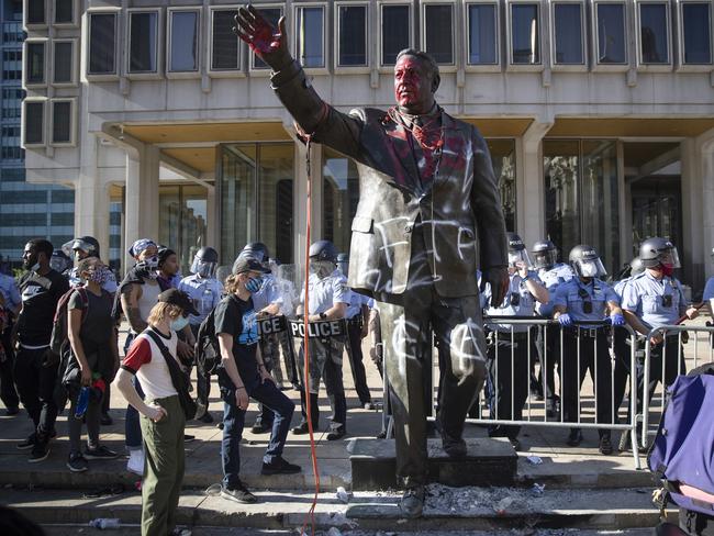 The statue of controversial former Philadelphia Mayor Frank Rizzo, who urged people to “vote white” was removed by authorities. Picture: AP