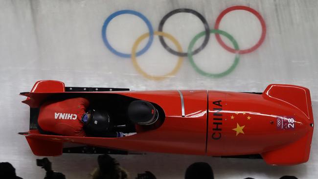 Driver Jin Jian and Shen Ke of China take a curve during the two-man bobsled competition at the 2018 Winter Olympics in South Korea. Picture: AP Photo/Wong Maye-E