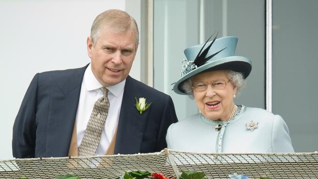 Prince Andrew, the Duke of York with Queen Elizabeth II at the Epsom Derby Festival in 2013.