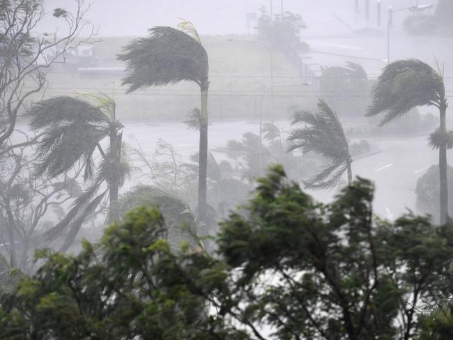 Strong winds and rain lash Airlie Beach, Tuesday, March 28, 2017. Cyclone Debbie is expected to hit Queensland's far north coast as a category 4 cyclone early afternoon today. Picture: AAP Image/Dan Peled