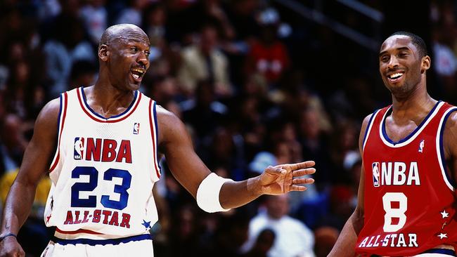 Michael Jordan talks with Kobe Bryant during the 2003 NBA All-Star game in Atlanta.