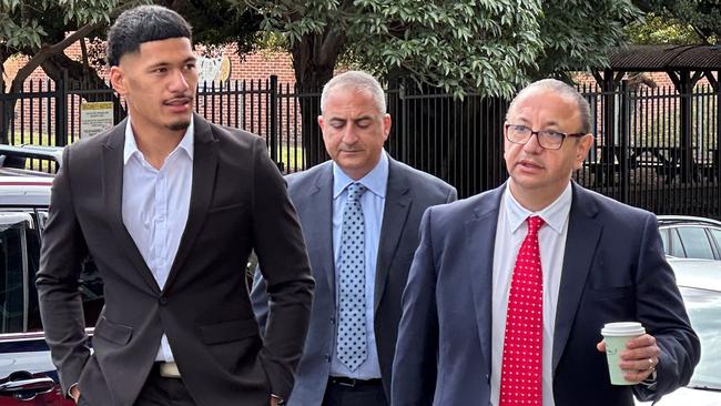 Dragons player Junior Amone, his manager Mario Tartak and his lawyer Elias Tabchouri entering Wollongong Local Court on Friday, August 18, 2023. Picture: Dylan Arvela