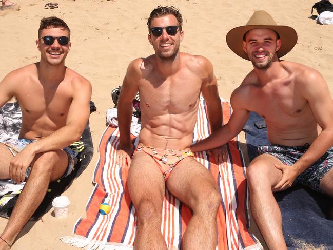 Paul Lo Presti and brothers Marcus and Nicholas De Leur enjoy a summers day at the beach in Lorne. Picture: Alison Wynd