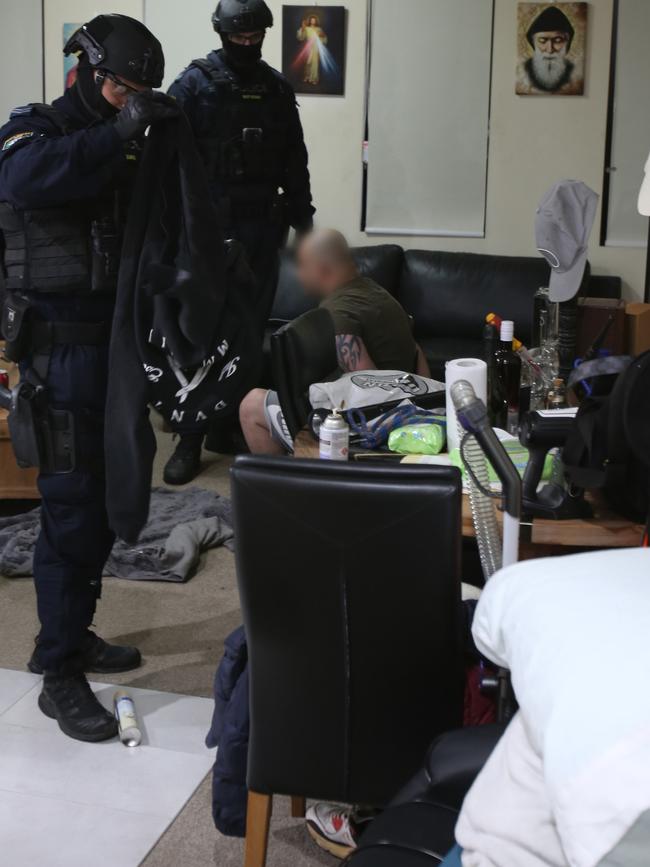 Heavily armed police and the dog squad stormed homes across western Sydney this morning as part of an investigation into the Finks bikie gang. Picture: NSW Police