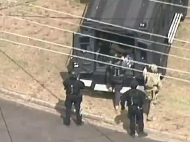 Police negotiated with a 22-year-old man for several hours before arresting him just before 7pm. Picture: 7 News