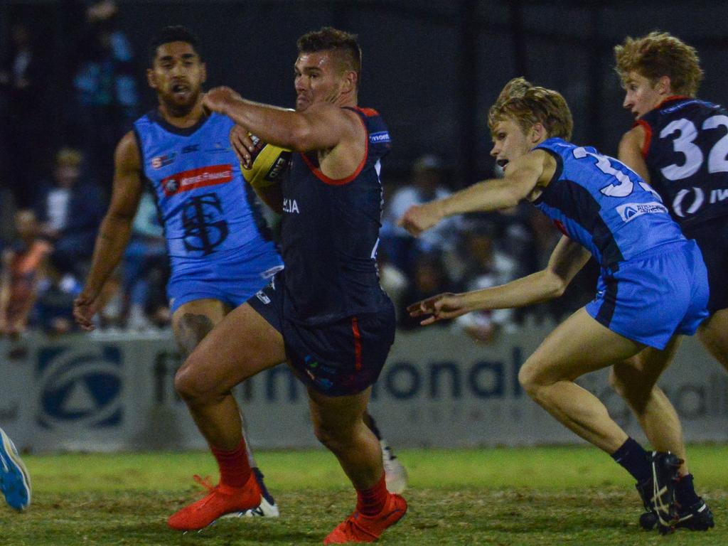 SANFL: Norwood v Sturt at Norwood Oval, Friday, April 12, 2019. Norwood's Mitchell Grigg is caught by Steven Slimming. (AAP Image/Brenton Edwards),