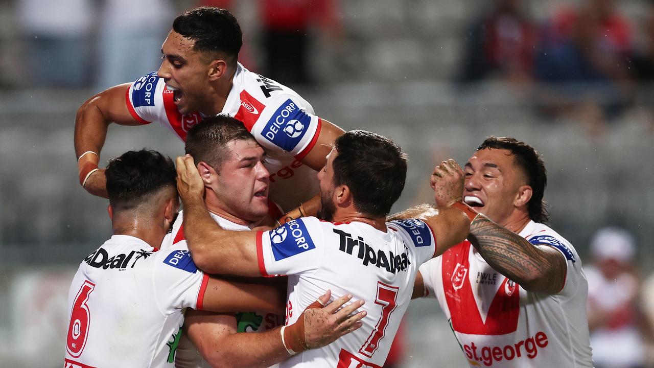 SYDNEY, AUSTRALIA - MARCH 12: Blake Lawrie of the Dragons celebrates with team mates after scoring a try during the round two NRL match between the St George Illawarra Dragons and the Gold Coast Titans at Netstrata Jubilee Stadium on March 12, 2023 in Sydney, Australia. (Photo by Matt King/Getty Images)