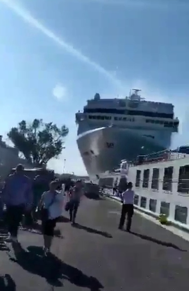 Social media video grabs of a cruise ship as it lost control coming in to dock in Venice on Sunday, crashing into the wharf and hitting a tourist boat. Picture: Supplied