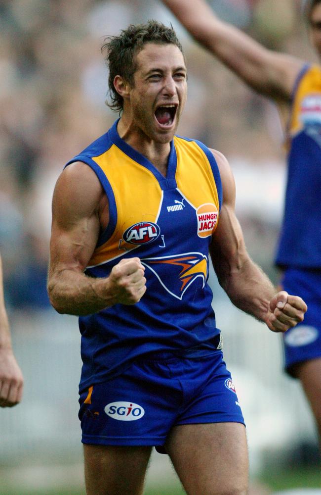 Chad Fletcher celebrates an Eagles premiership after the siren sounds in the 2006 Grand Final.