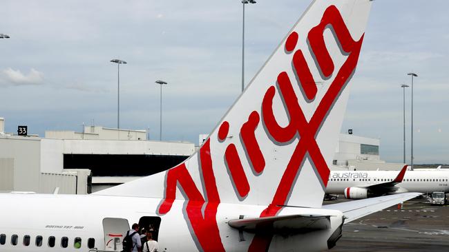 Three men were escorted off a Virgin Australia flight after becoming drunk and one vaping in his seat, police say. Picture: NCA NewsWire / Nicholas Eagar