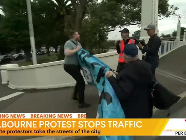 Commuters in chaos as protest blocks off major Melbourne overpass