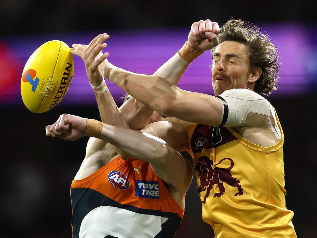 Daniher flies in a marking contest against Sam Taylor. Picture: Phil Hillyard