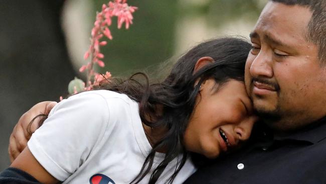 Grief-stricken children and parents gathered in the Texan town of Uvalde after the massacre at a local elementary school. Picture: Reuters