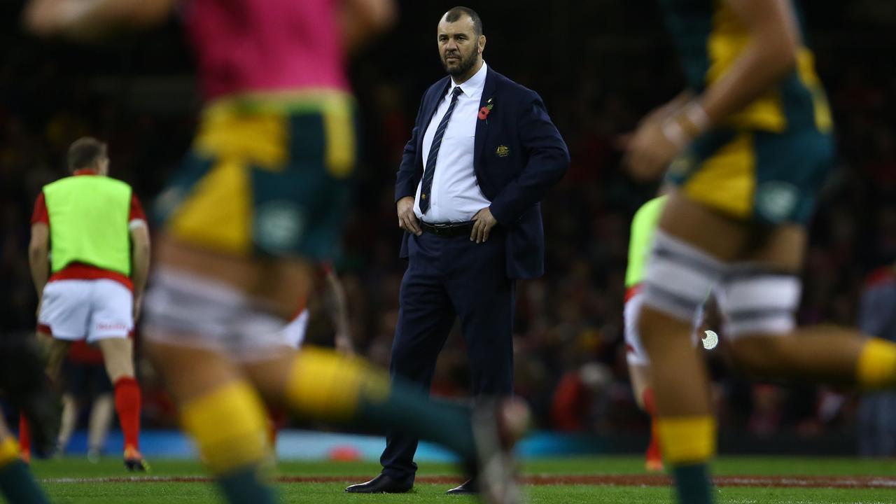 Australia coach Michael Cheika watches his players warm up in Cardiff.