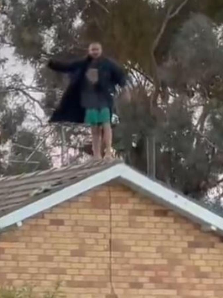 The armed man locked himself in a bedroom before climbing on the roof. Picture: X@DJPizarro