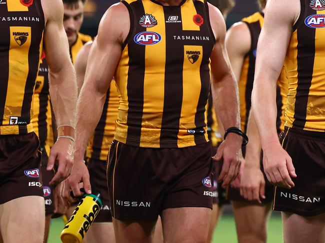 MELBOURNE, AUSTRALIA - APRIL 28: James Sicily and his Hawks team mates look dejected after losing the round seven AFL match between Hawthorn Hawks and Sydney Swans at Melbourne Cricket Ground, on April 28, 2024, in Melbourne, Australia. (Photo by Quinn Rooney/Getty Images)